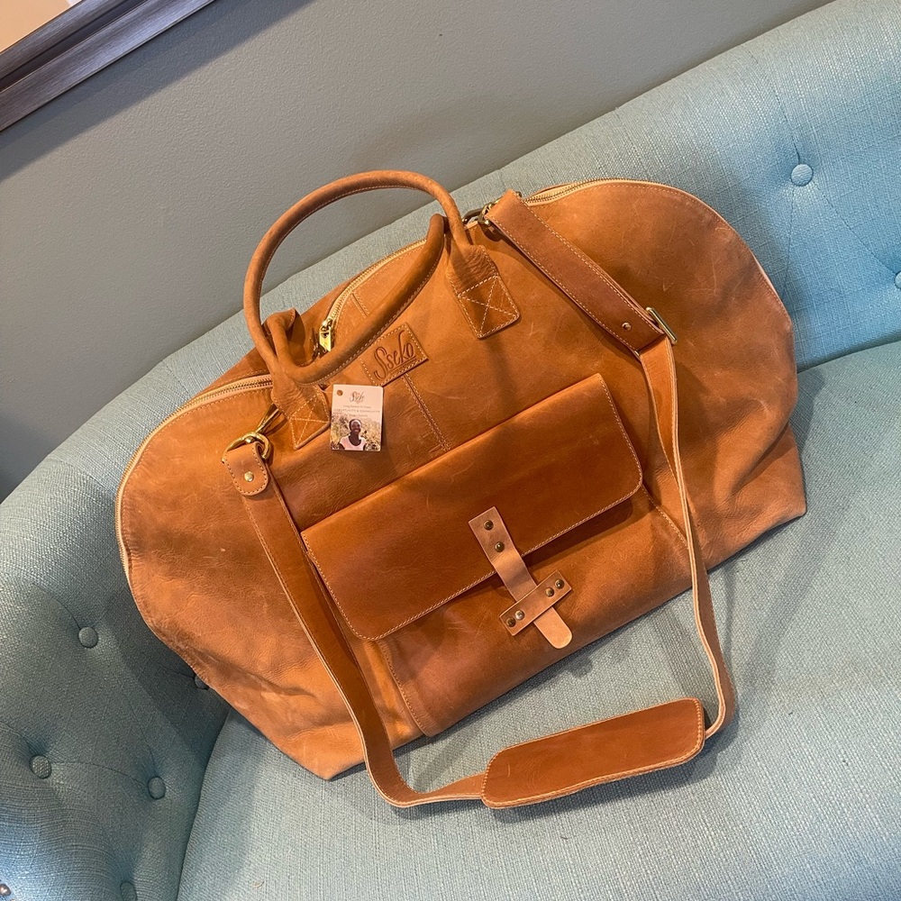 Sseko leather travel bag new Treated w protectant